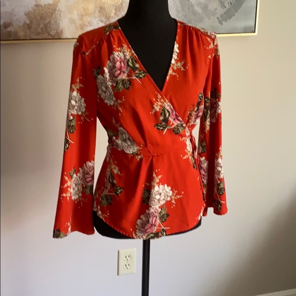 Red floral wrap top